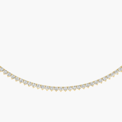 Gold necklace with diamonds on a white background
