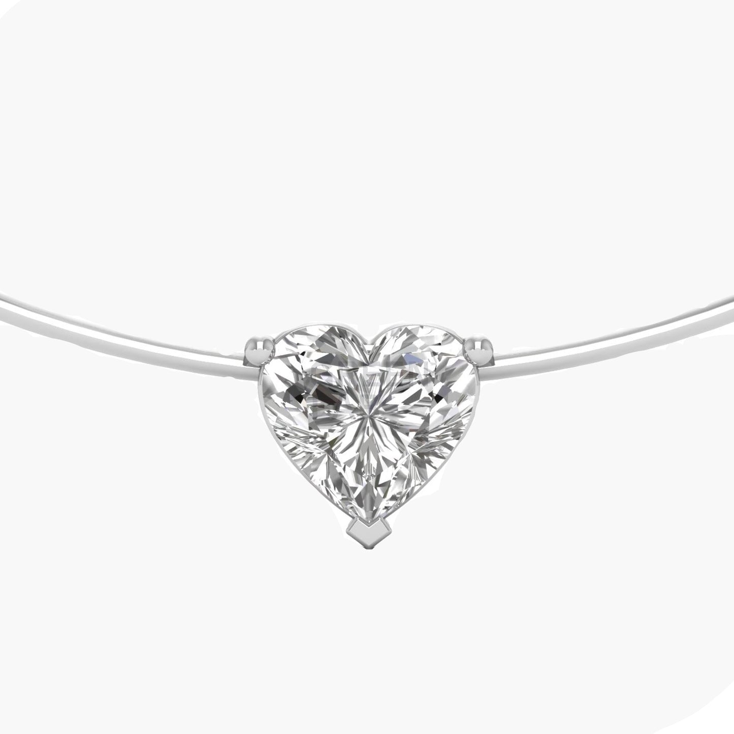 Heart-shaped diamond pendant on a white background