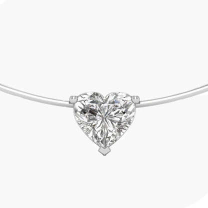 Heart-shaped diamond pendant on a white background