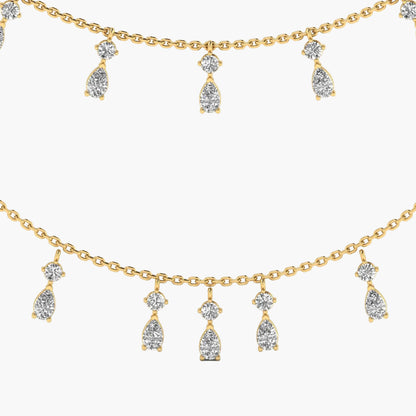 Gold necklace with teardrop-shaped diamond pendants on a white background, branded 'Green Lab'.