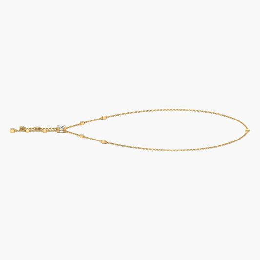Gold necklace with a small pendant on a white background