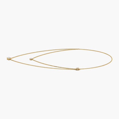 Gold necklace on a white background with 'Green & Co.' branding.