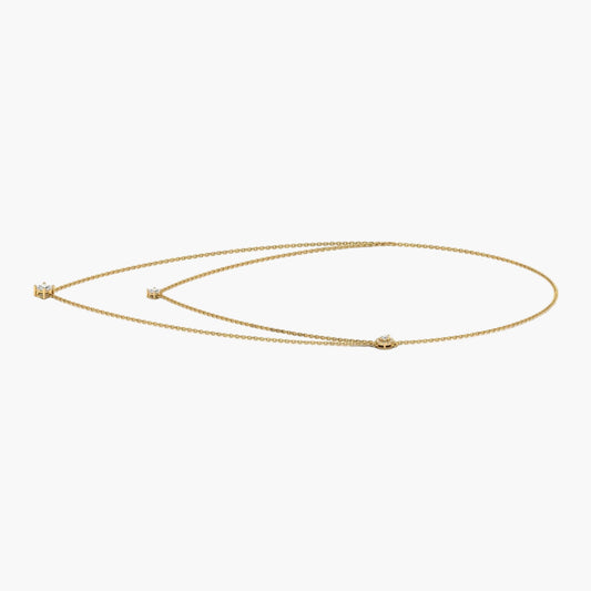 Gold necklace on a white background with 'Green & Co.' branding.