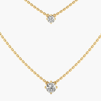 Gold necklace with diamond pendants on a white background, branded 'Green Lab'.