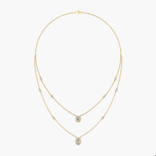 Gold necklace with green gemstones on a white background, featuring the brand 'Green Lab'.