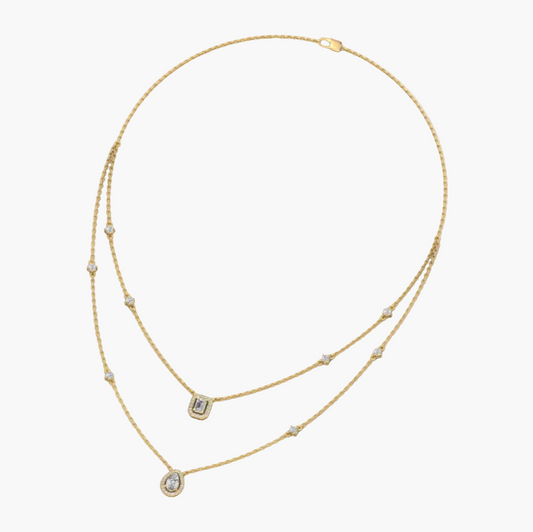 Gold necklace with small diamonds on a white background, branded 'Green Lab'.