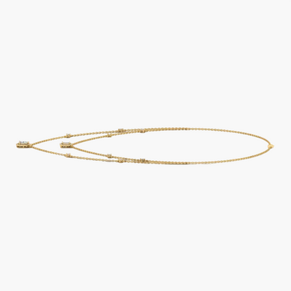 Gold necklace on a white background