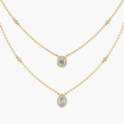 Gold necklace with diamond pendants on a white background