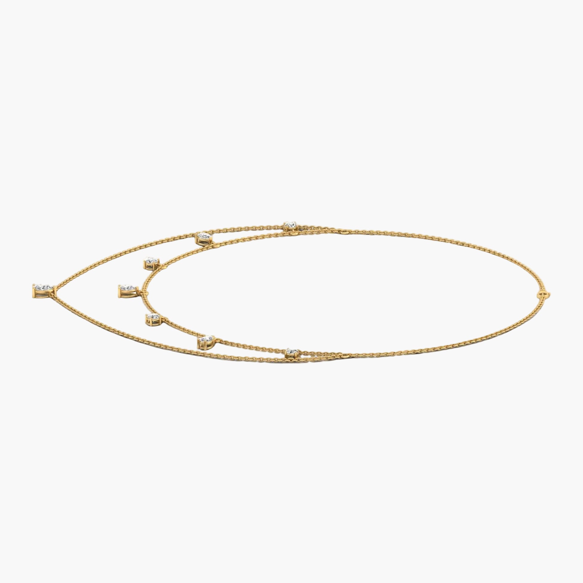 Gold necklace with small stones on a white background, branded 'Green Lab'.