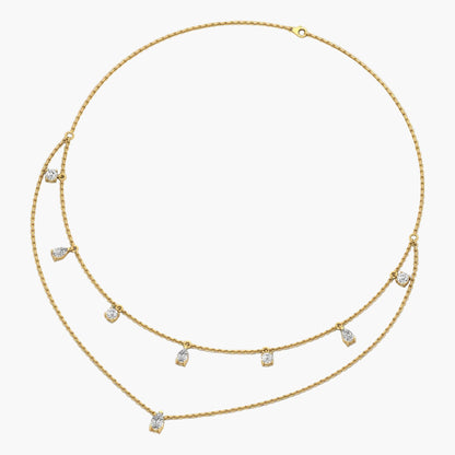 Gold necklace with small diamonds on a white background, branded 'Green Lab'.