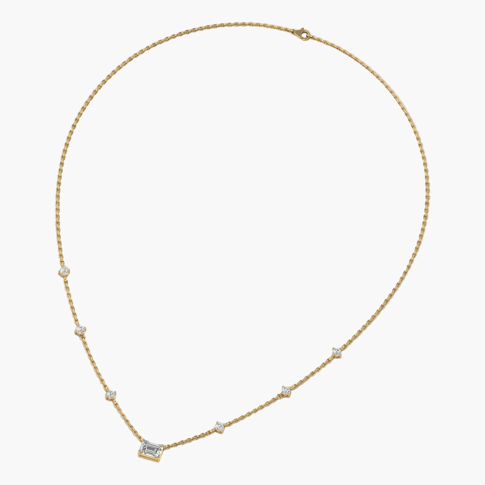 Gold necklace with small diamonds on a white background, branded 'Green Lab'.