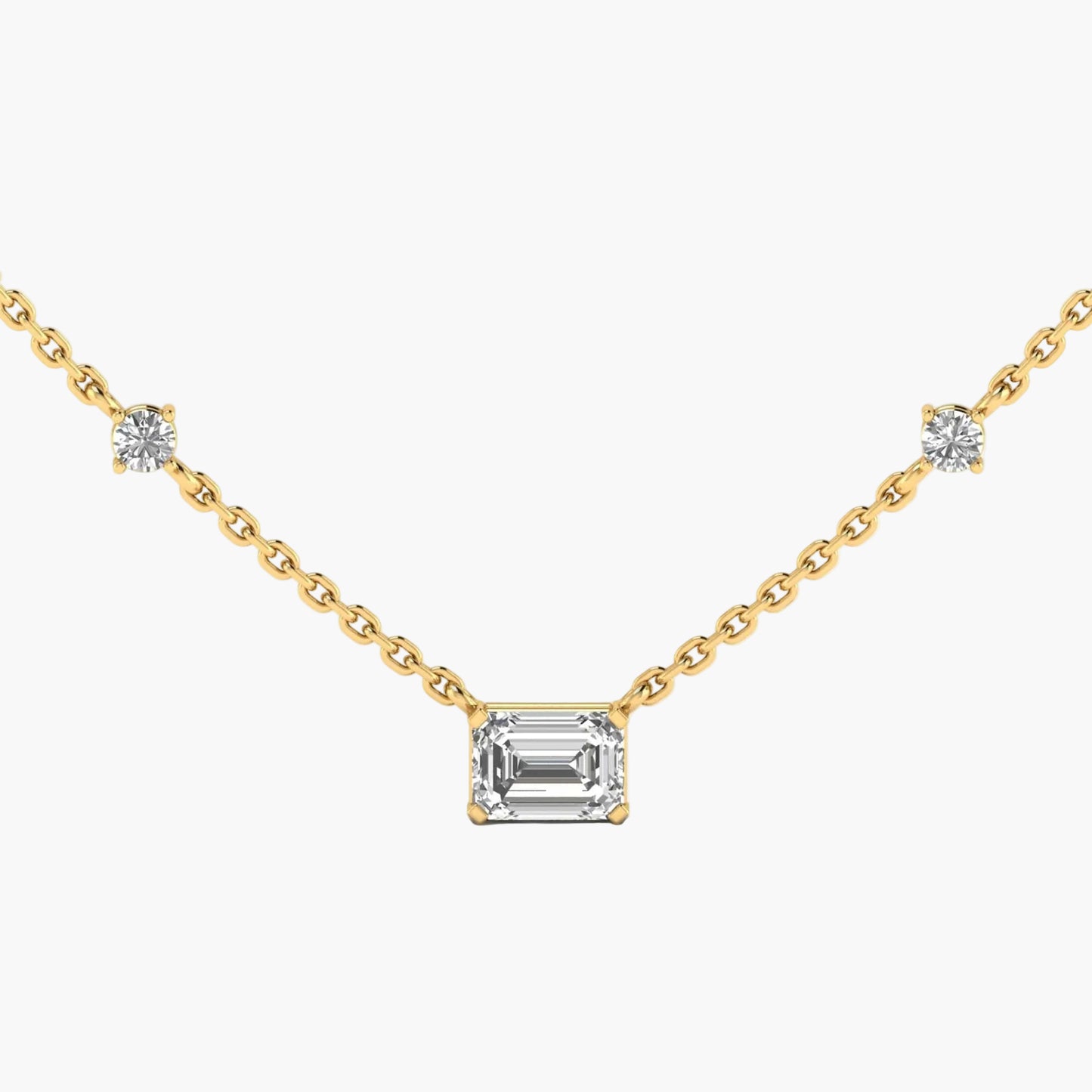 Gold necklace with a central emerald-cut diamond and side diamonds on a white background, branded 'Green Lab'.