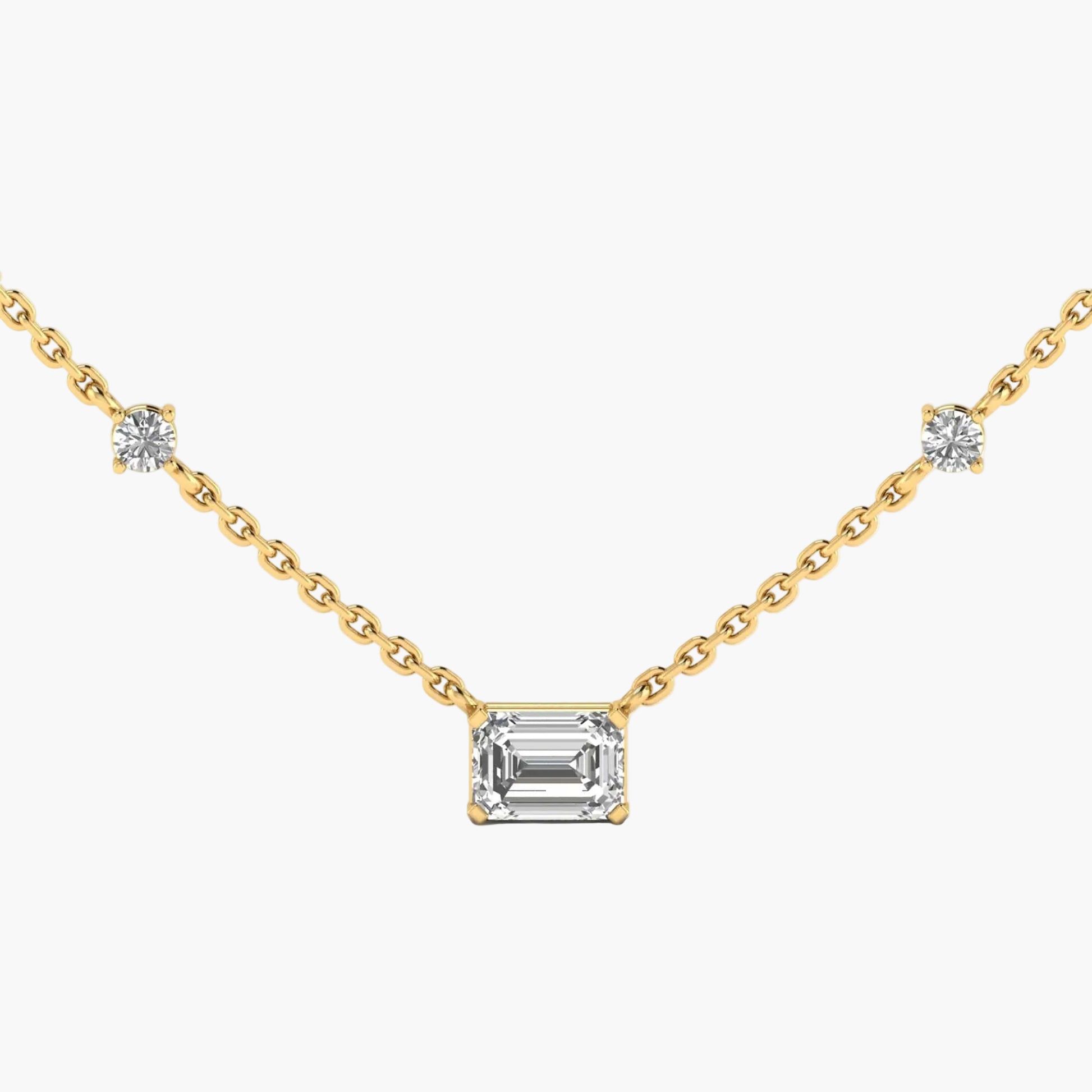 Gold necklace with a central emerald-cut diamond and side diamonds on a white background, branded 'Green Lab'.