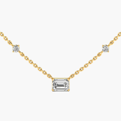 Gold necklace with a central emerald-cut diamond and side diamonds on a white background, branded 'Green Lab'.