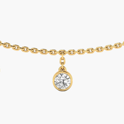 Gold necklace with a diamond pendant on a white background