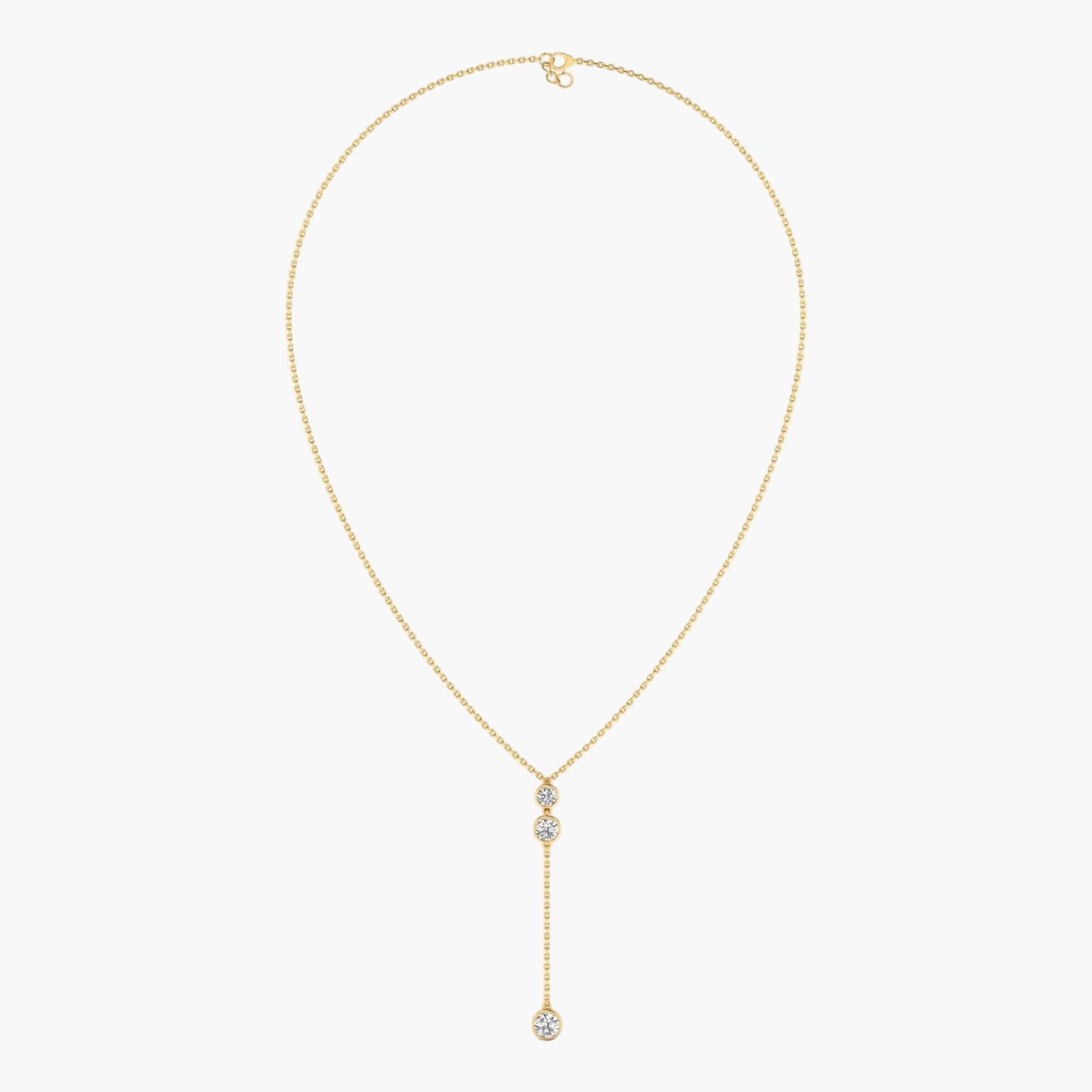 Gold necklace with a diamond pendant on a white background
