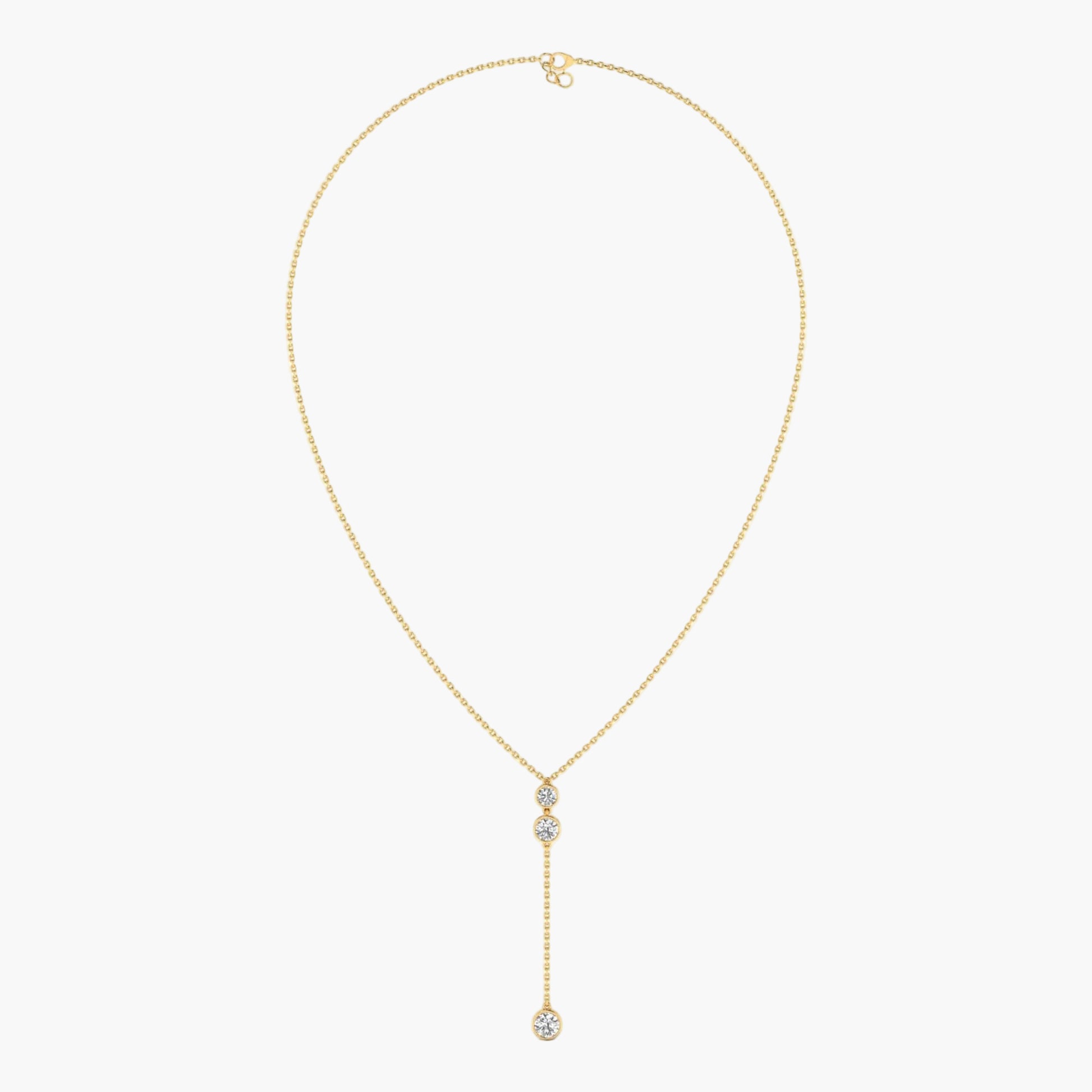 Gold necklace with a diamond pendant on a white background