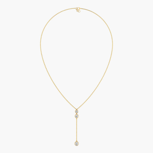 Gold necklace with a diamond pendant on a white background