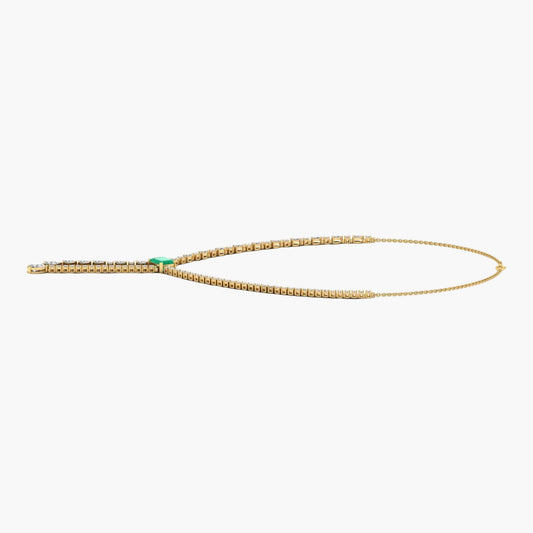Gold necklace with green gemstone on a white background