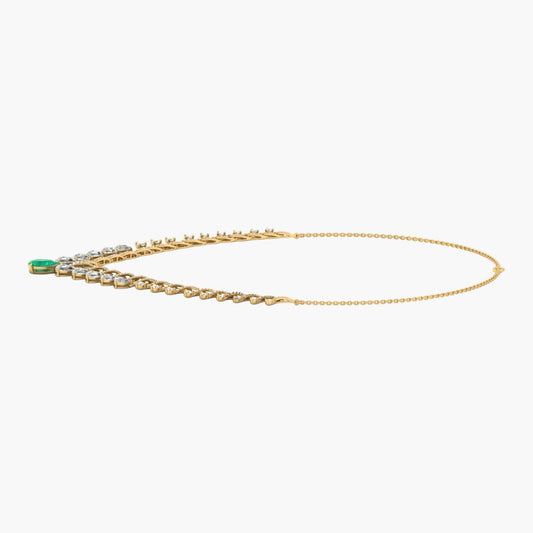 Gold necklace with green gemstone on a white background