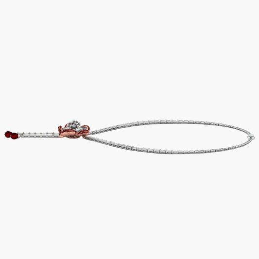 Silver bracelet with a red accent on a white background