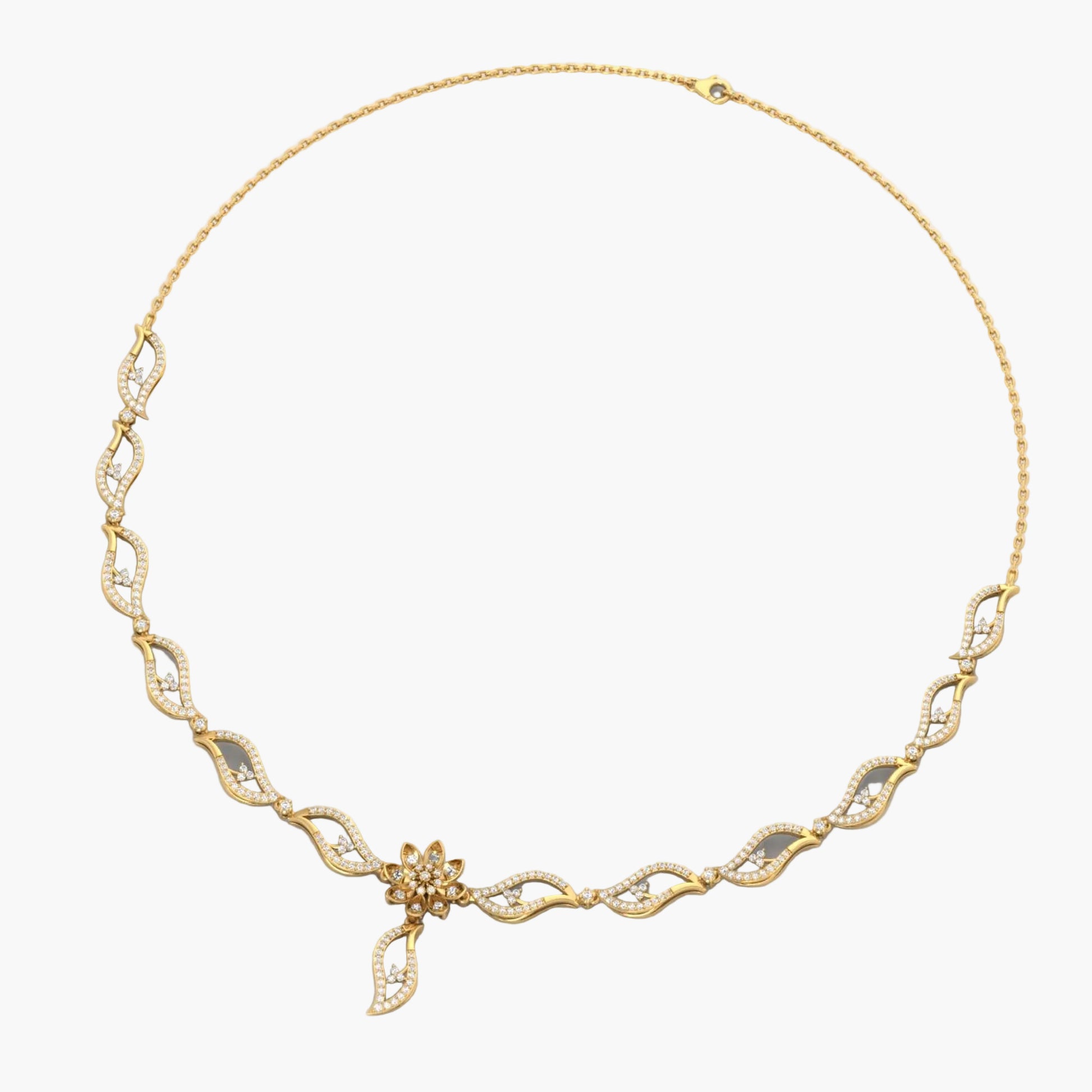 Gold necklace with intricate design on a white background, featuring 'Green Lab' branding.