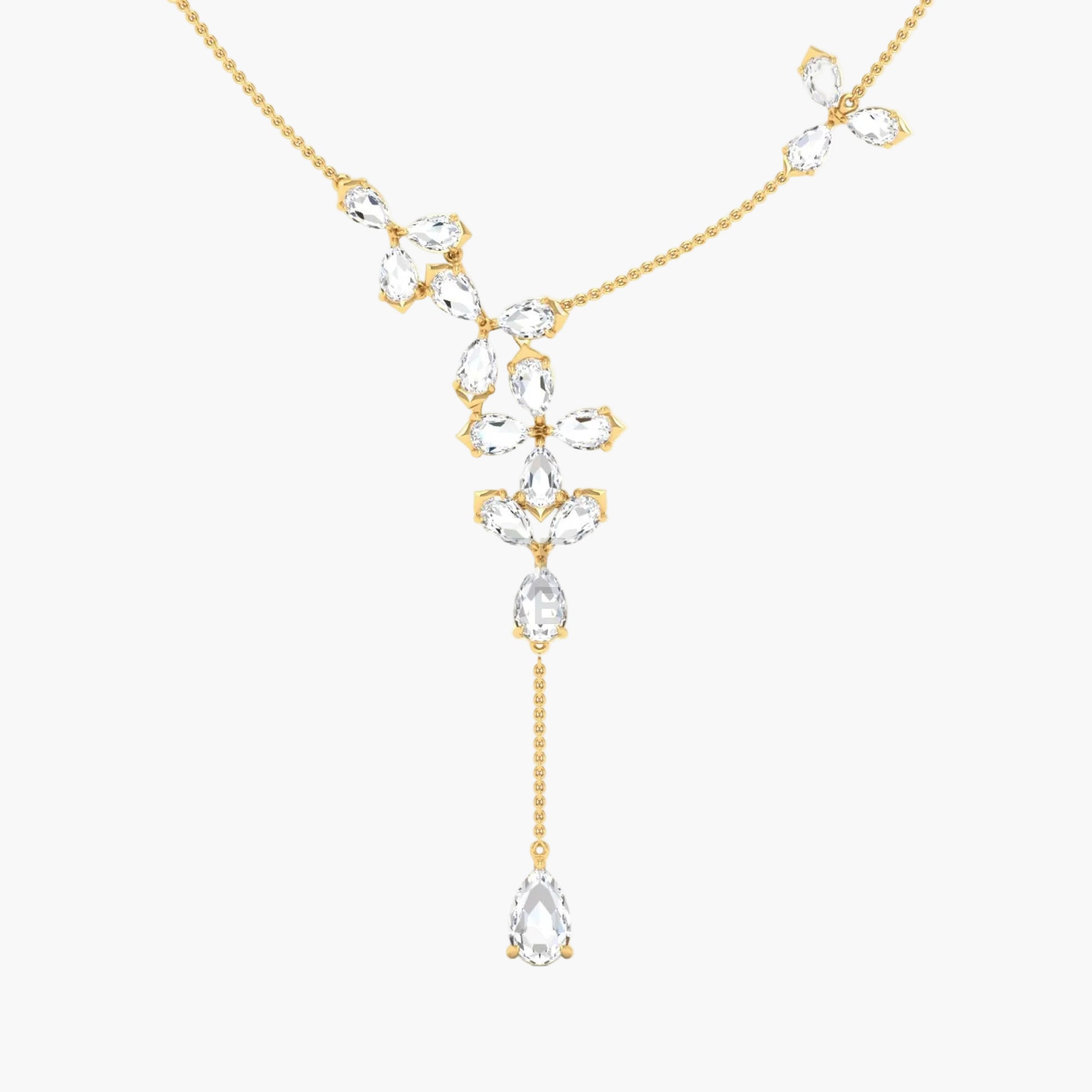 Gold necklace with clear gemstones on a white background