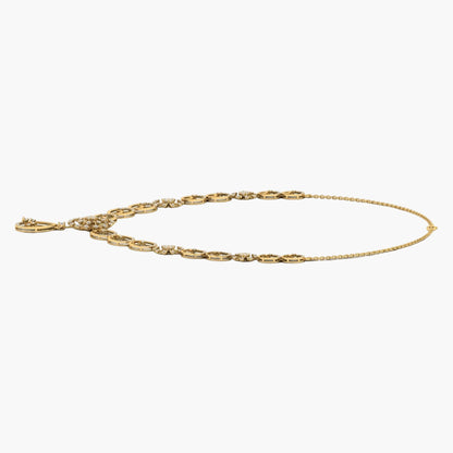 Gold anklet on a white background with 'Green & Co' branding.