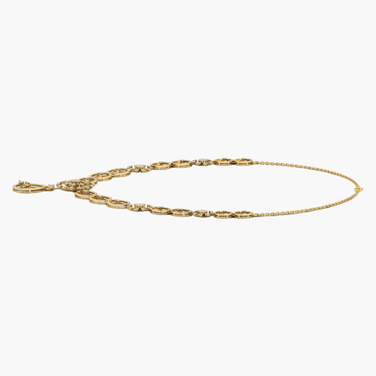 Gold anklet on a white background with 'Green & Co' branding.