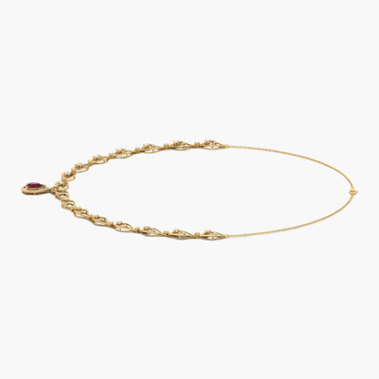 Gold bracelet with a red gemstone on a white background, branded 'Green Lab'.