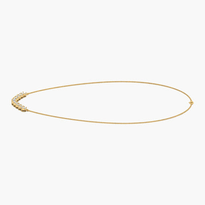 Gold necklace on a white background with 'Green Lab' branding.