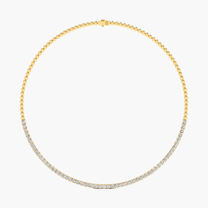 Gold necklace with diamonds on a white background
