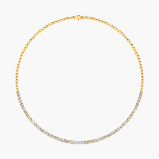 Gold necklace with diamonds on a white background