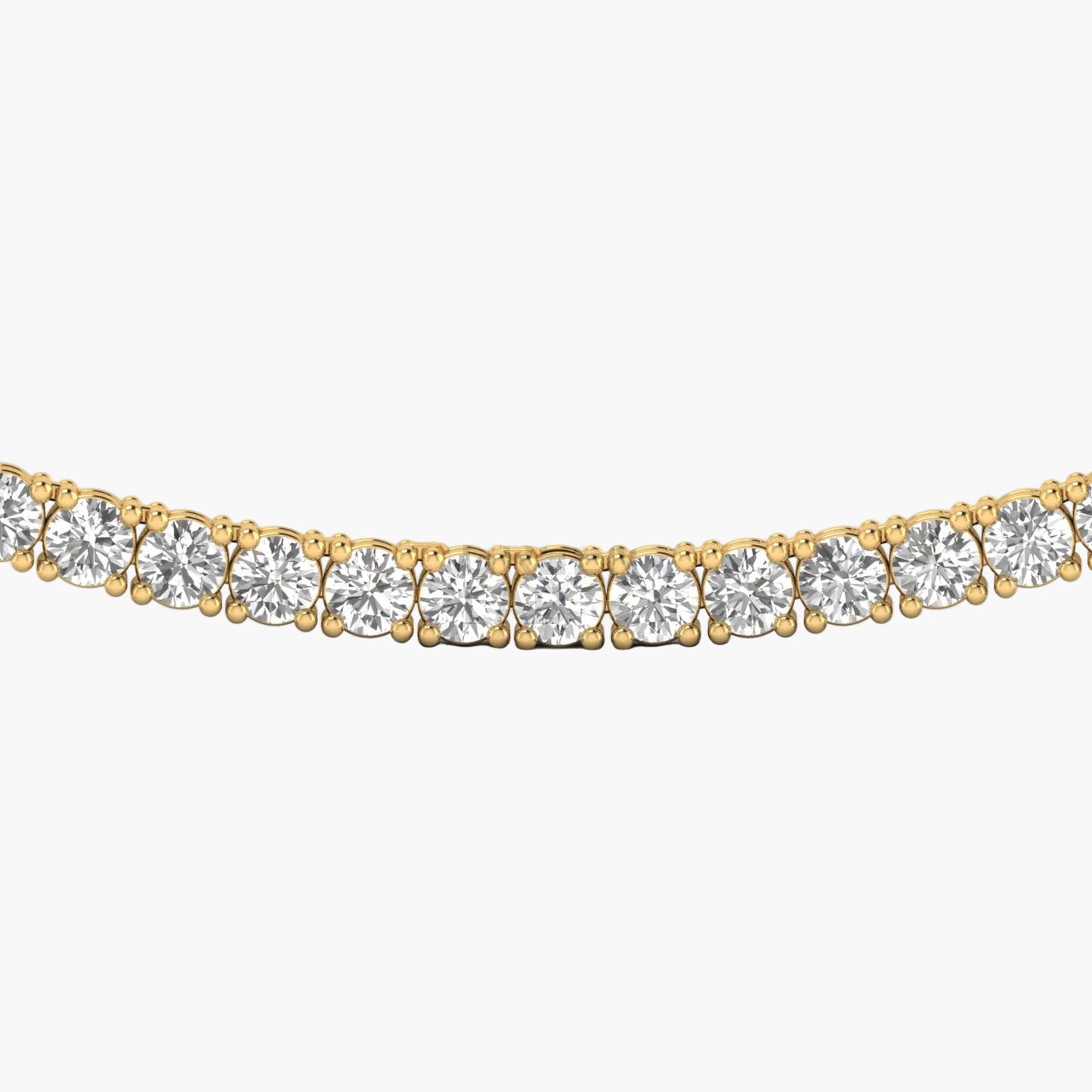 Gold necklace with clear gemstones on a white background