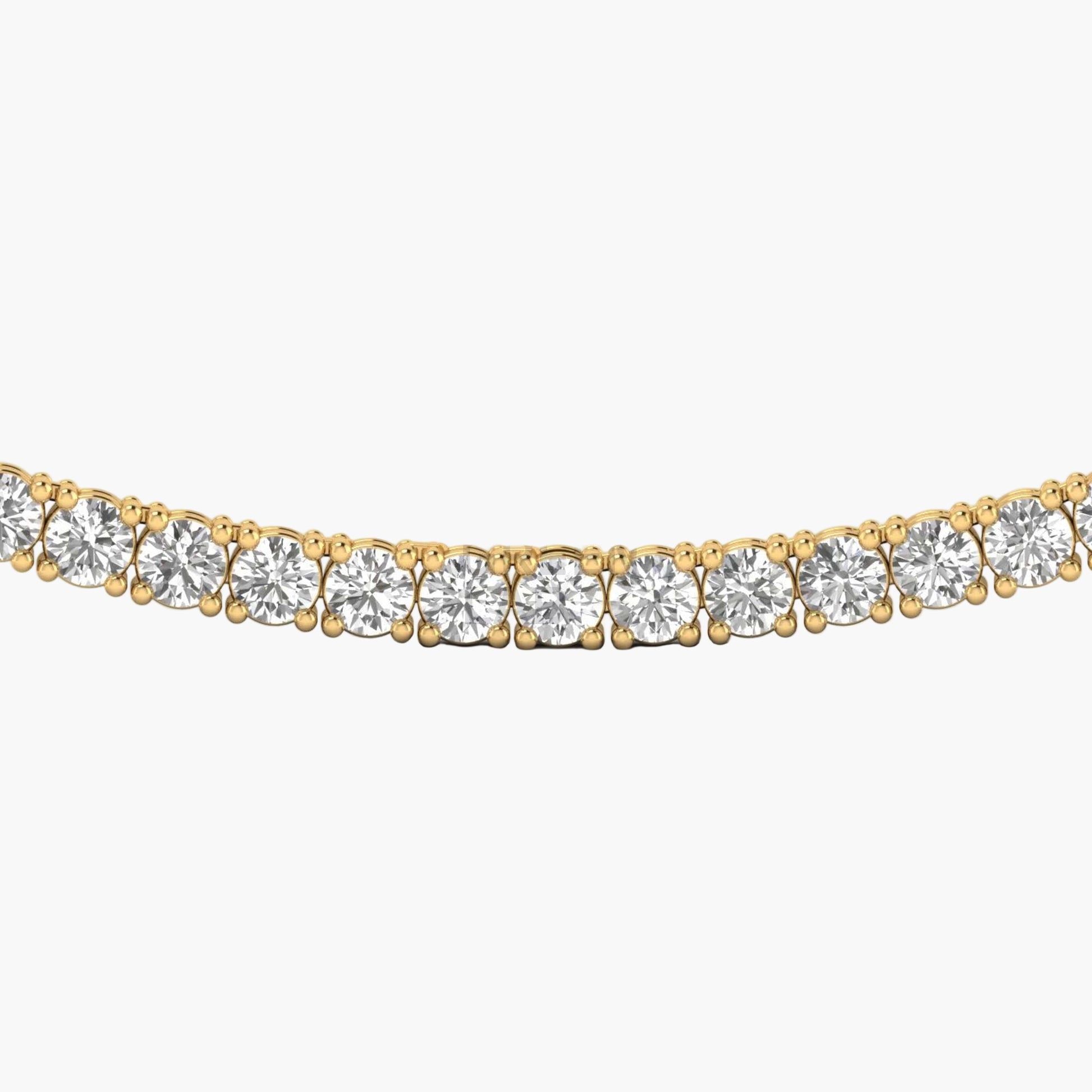 Gold necklace with clear gemstones on a white background