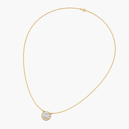 Gold necklace with a diamond pendant on a white background