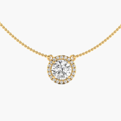 Gold necklace with a round diamond pendant on a white background