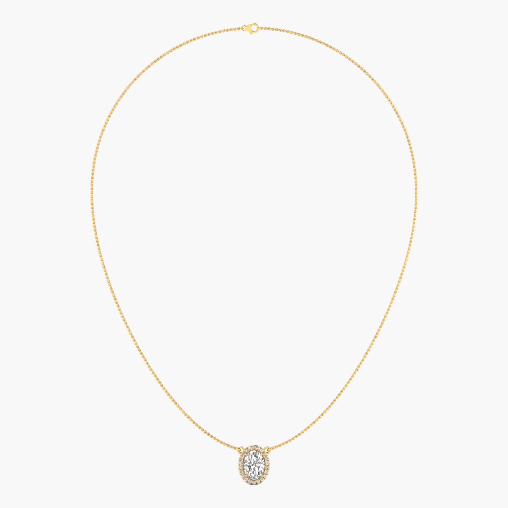 Gold necklace with a diamond pendant on a light gray background