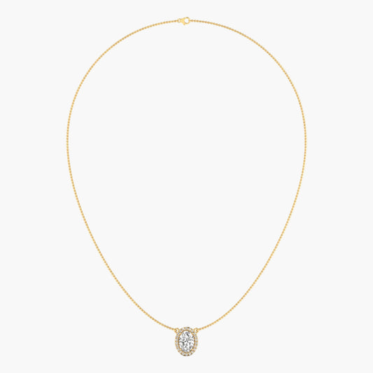 Gold necklace with a diamond pendant on a light gray background