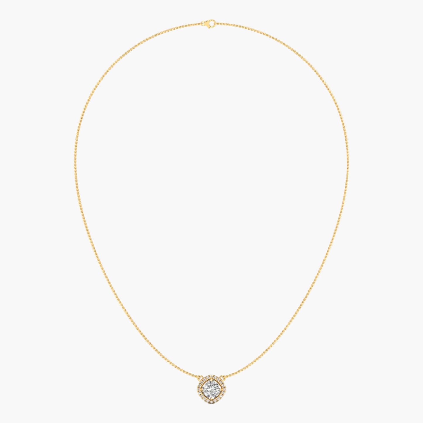 Gold necklace with a small round pendant on a light beige background