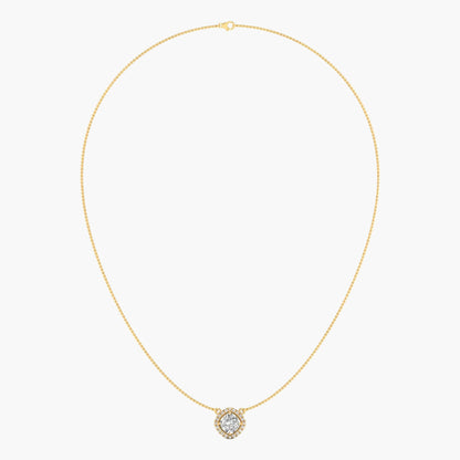 Gold necklace with a small round pendant on a light beige background