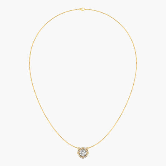 Gold necklace with a small round pendant on a light beige background
