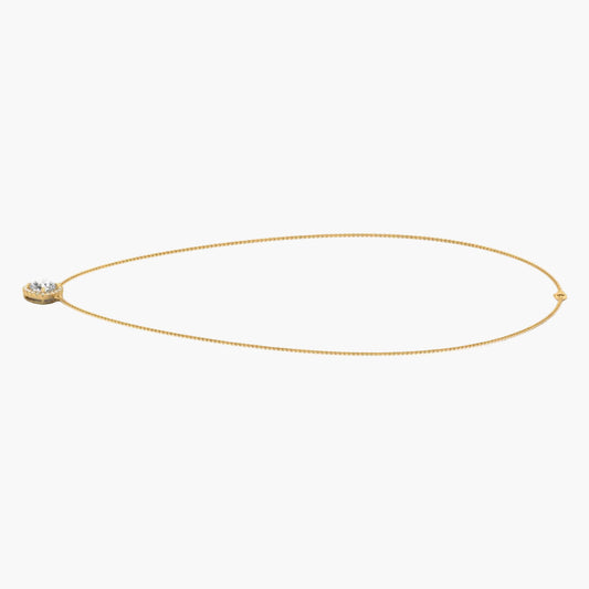 Gold necklace with a small pendant on a white background, branded 'Green Lab'.