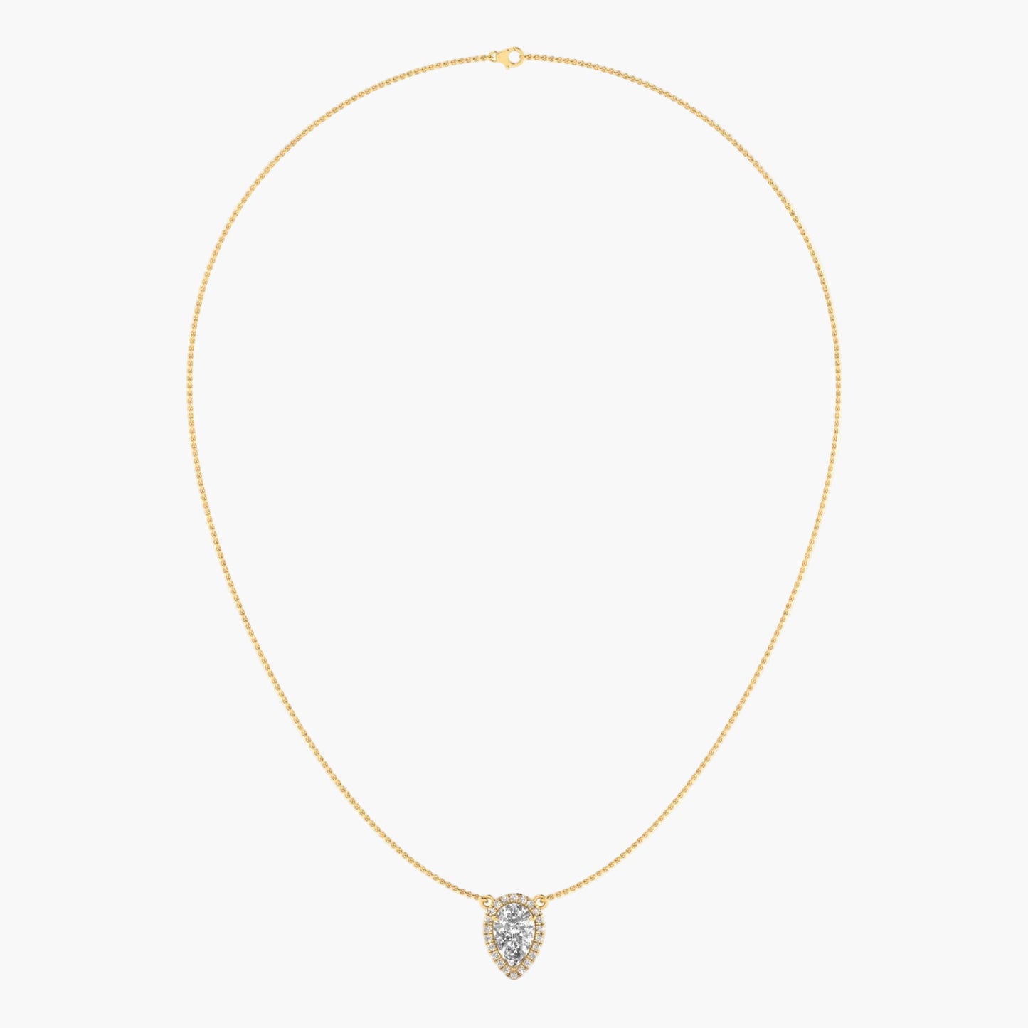 Gold necklace with a heart-shaped pendant on a light beige background