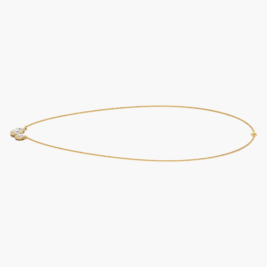 Gold necklace on a white background with 'Green Lab' branding.