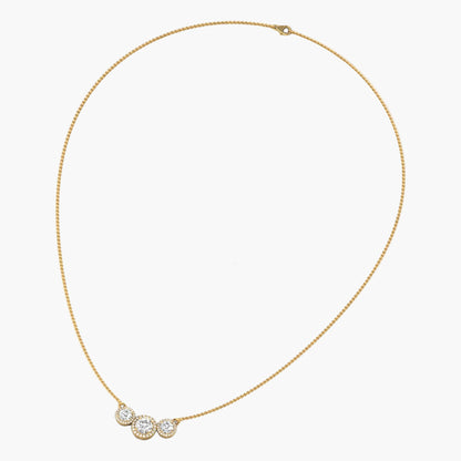 Gold necklace with three circular pendants on a white background, branded 'Green Lab'.