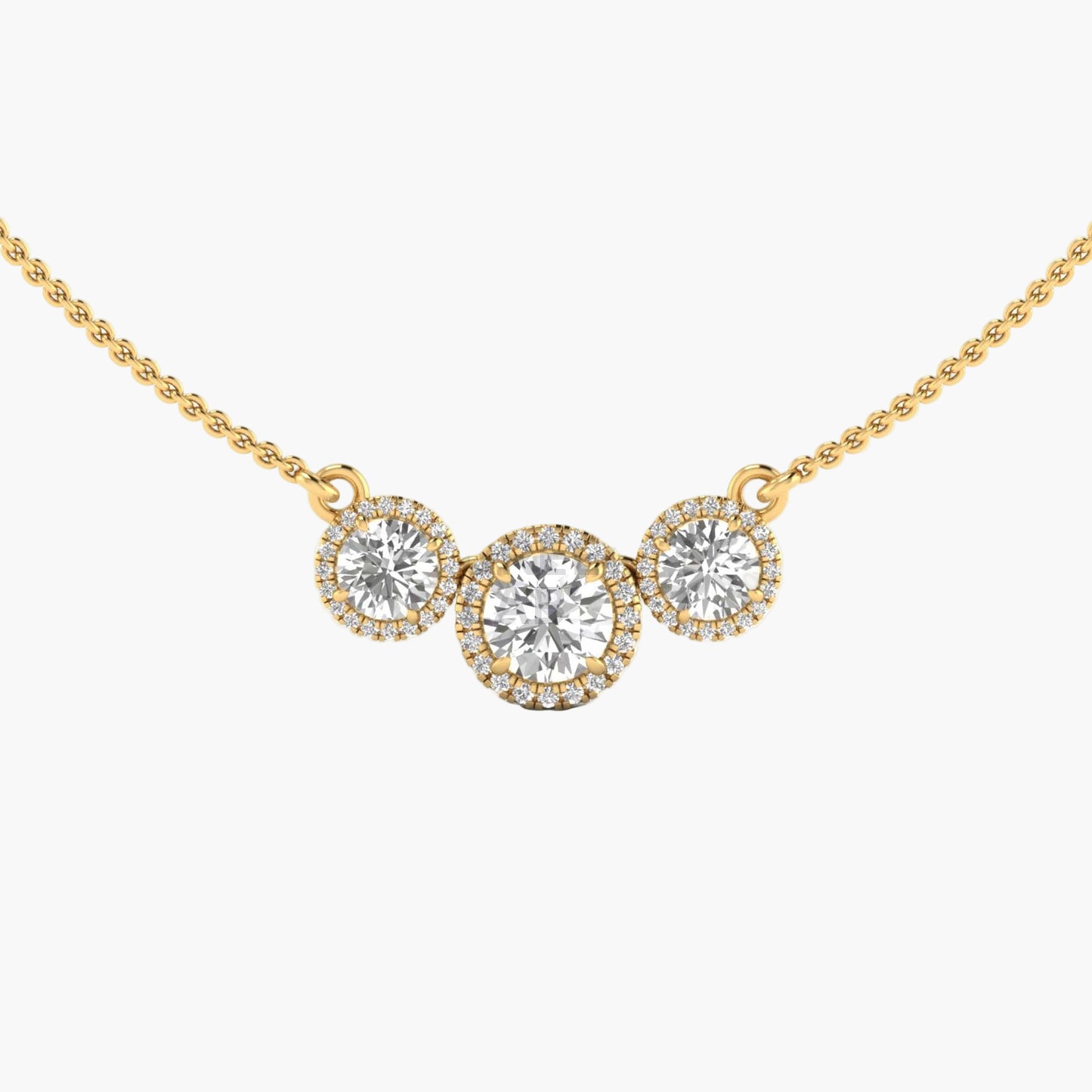 Gold necklace with three round diamonds on a white background