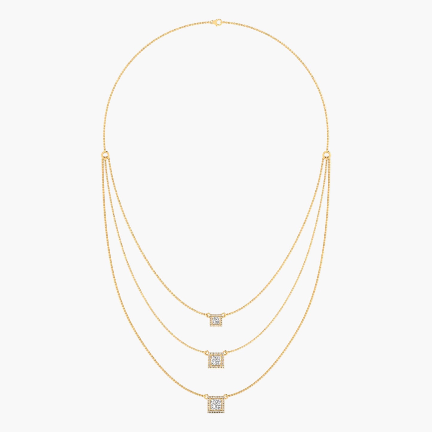 Gold necklace with square pendant on a white background
