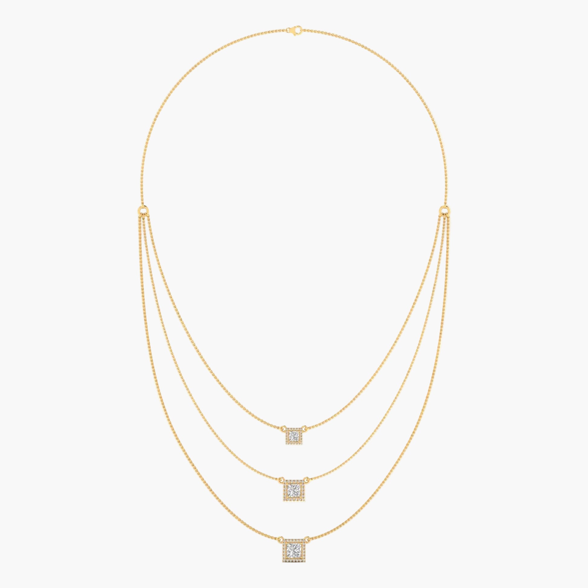Gold necklace with square pendant on a white background