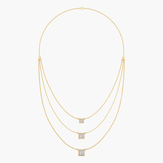 Gold necklace with square pendant on a white background